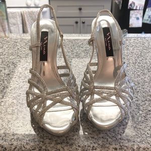 Nina New York. Lightly worn. Sparkly silver heels great for any event. 6.5